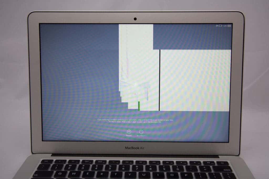 MacBook air 13" with damage in the center of the display causing 2 rectangles of white