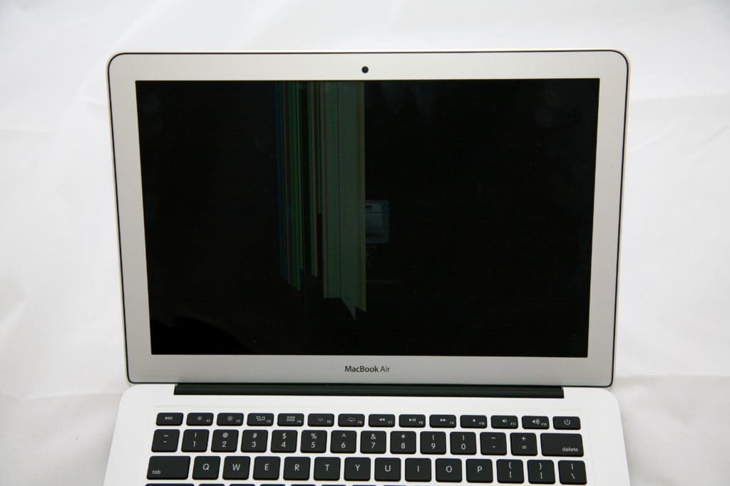 MacBook Air Screen Damage example. The left side of the screen obscured by damage.