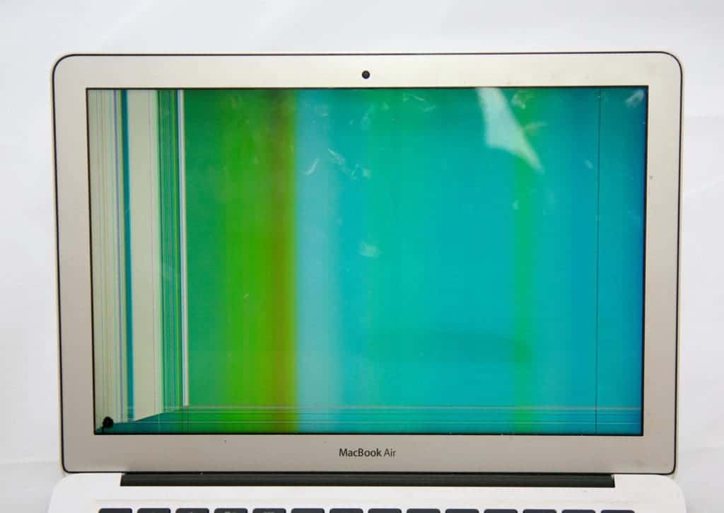 13 inch MacBook Air with blue and green hue from LCD damage. 