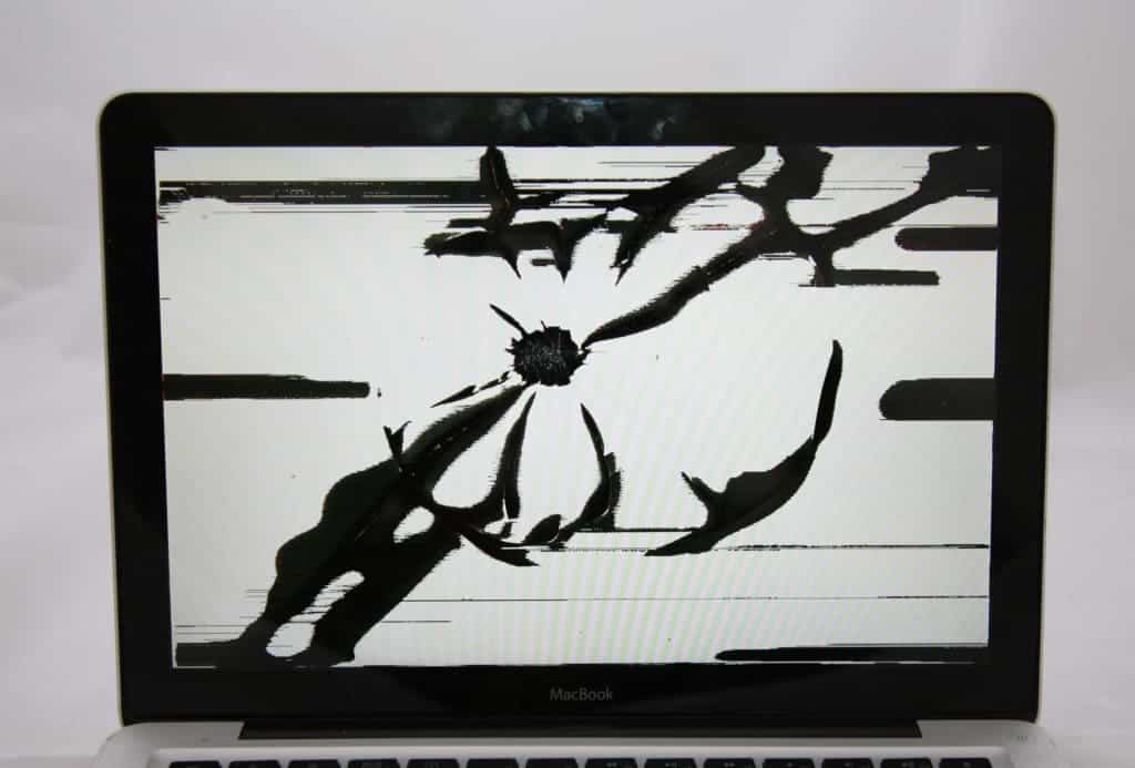 2008 13" MacBook with white and black splotches on the screen