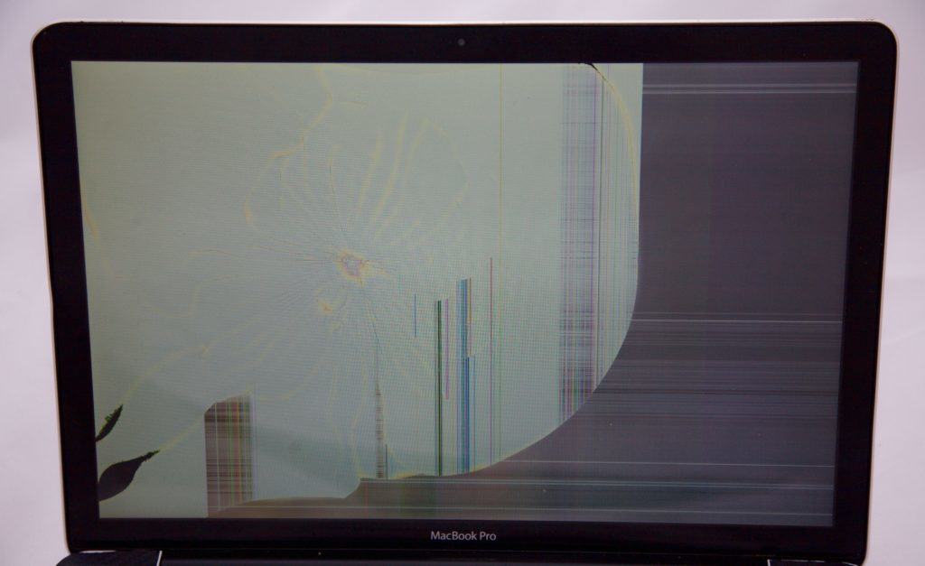2008 MacBook Pro that took a heavy hit from the back causing the LCD to be 80% white and the other visible area covered with lines.