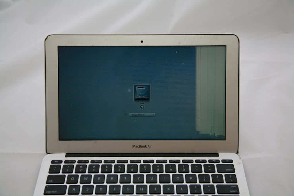 A1465 11" Macbook Air with crack on the bottom right of the screen that is causing vertical lines and white area on the far right 1/5 of the screen.