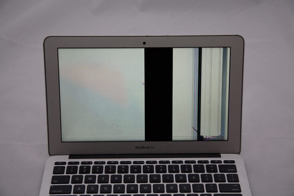 A1465 MacBook Air with crack on the bottom Right that is causing vertical bars and lines.