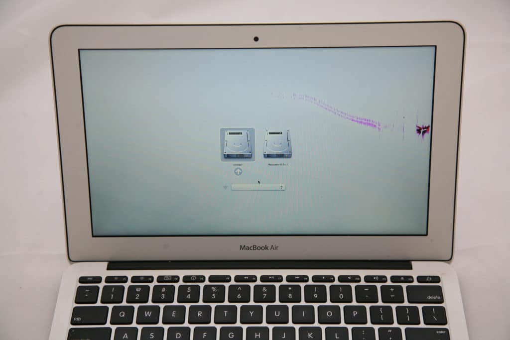 MacBook Air with hairline crack starting from impact point