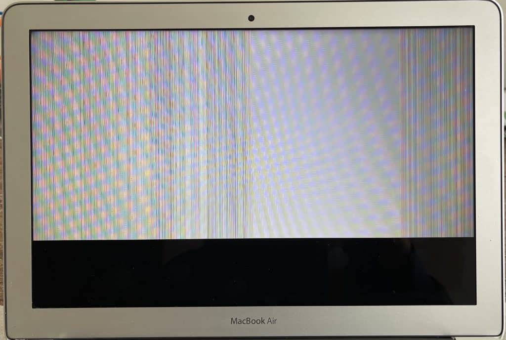 A1466 MacBook Air with bottom 1/5 of screen solid black and top 4/5 of screen showing vertical lines and white background.
