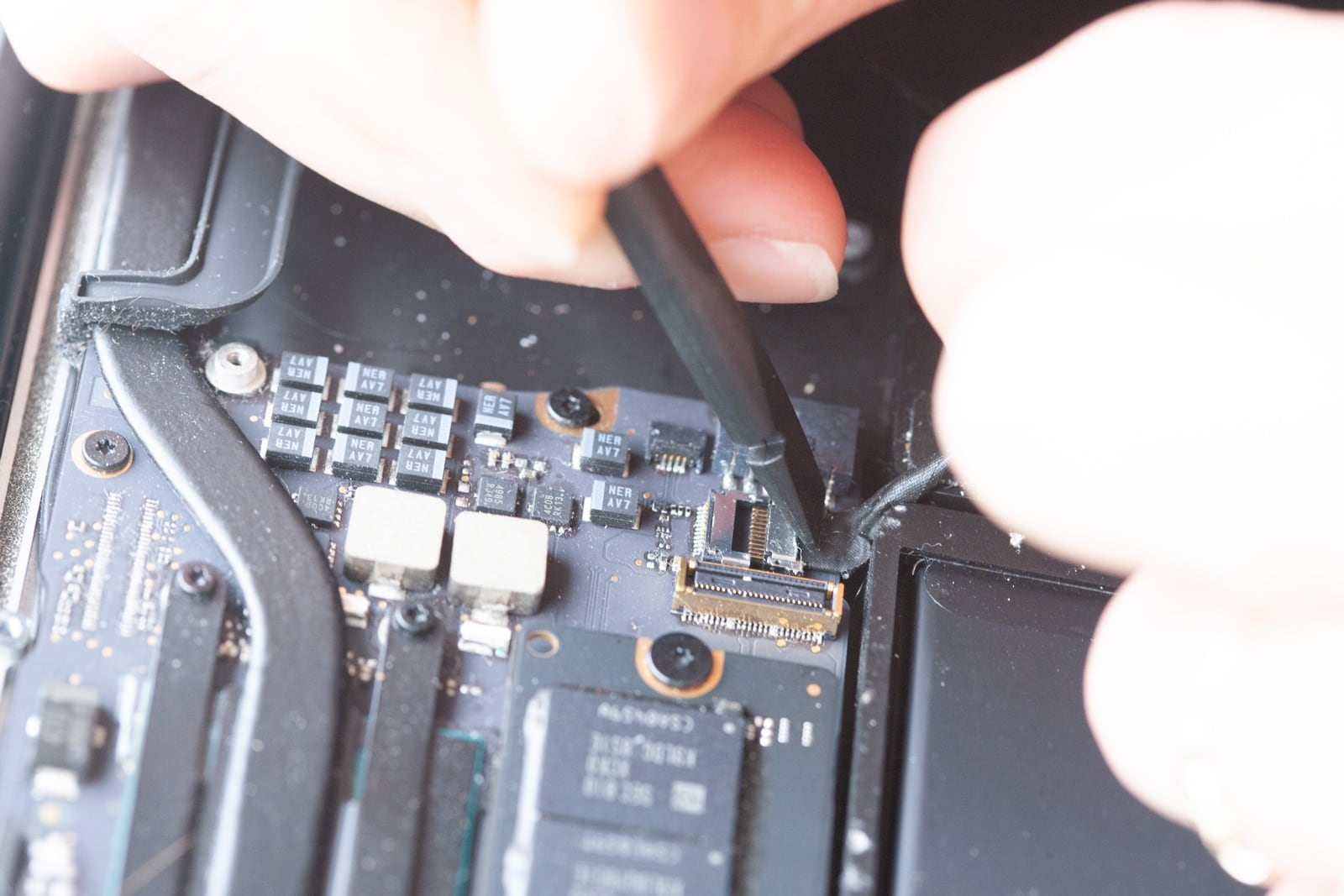Disconnecting Webcam cable on MacBook Air logic board