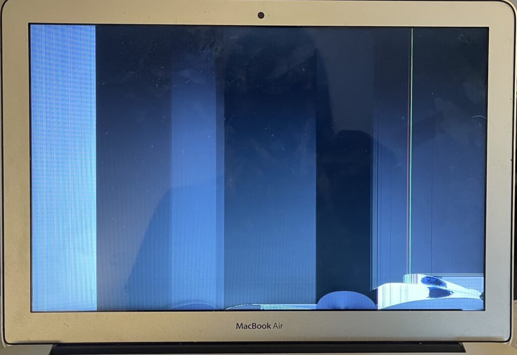 MacBook Air LCD cracked bottom right. Bars and lines on screen.