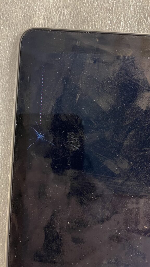 A1989 2019 MacBook Pro Hairline Crack Closeup
