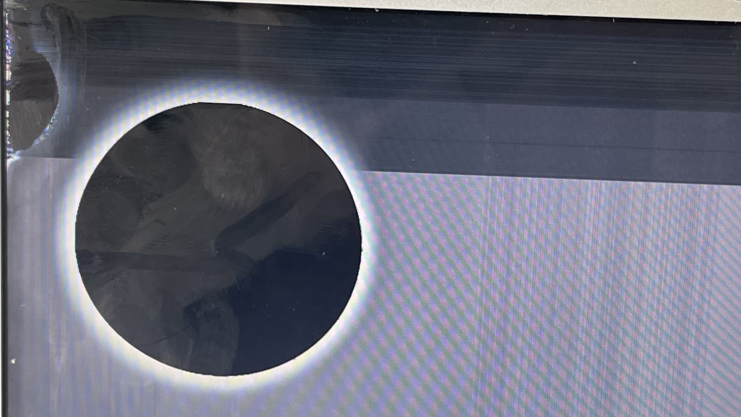Closeup of 2015 MacBook Air With Black Circle On Screen